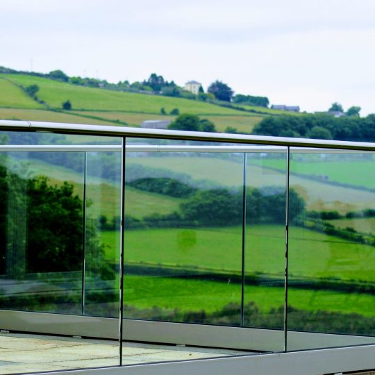 Frameless glass balustrade around a patio area in Cornwall