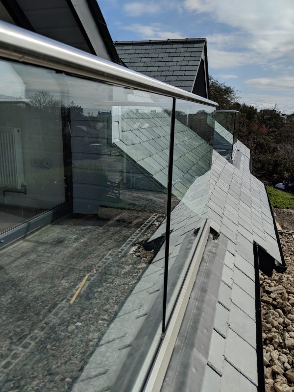 Glass balustrade fitted to a dorma balcony
