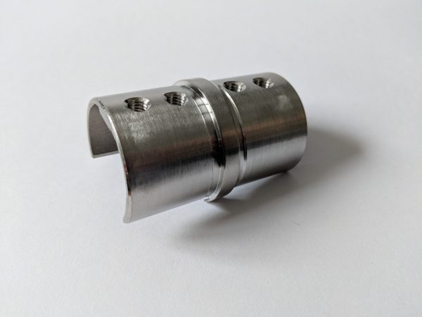 Slotted handrail connector fitting glass balustrade