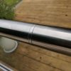 Slotted handrail connector for use on frameless glass balustrades
