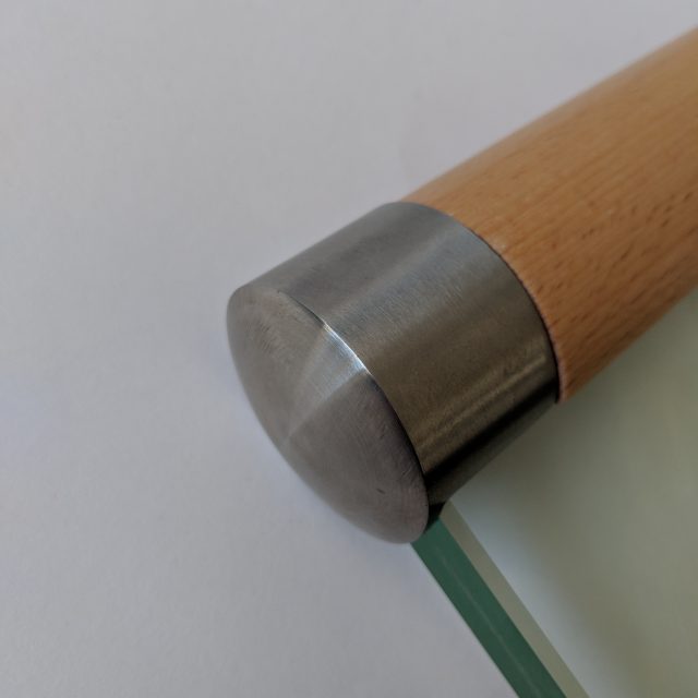 Steel end cap for slotted wood handrail